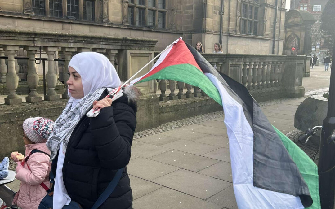 Palestinian protesters at Town Hall call for bank boycott