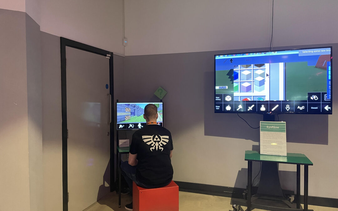 A visitor is exploring the Eyemine technology to play Minecraft.