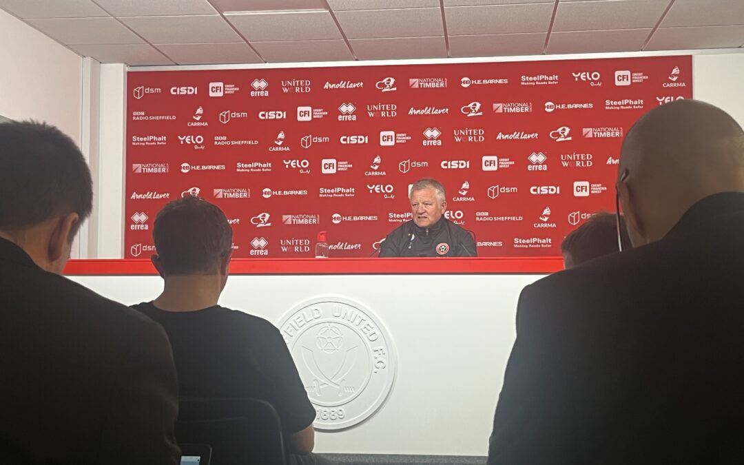 SUFC manager Chris Wilder sat at his desk delivering the pre-match press conference.