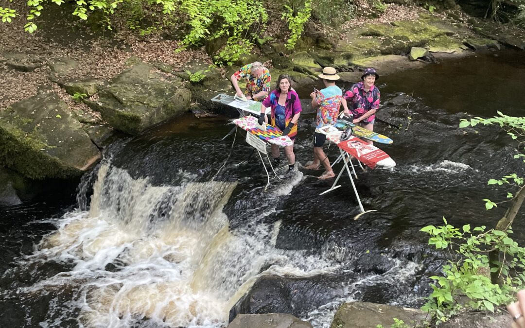 Open water swimmers partake in extreme ironing to campaign for better access to open water
