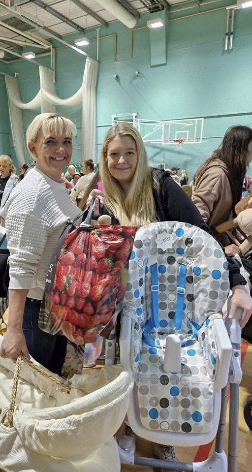 Attendees smile at previous Baby Boutique sale
