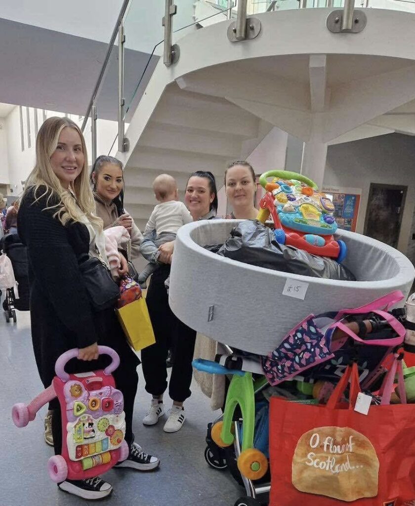 Attendees smile at previous Baby Boutique sale