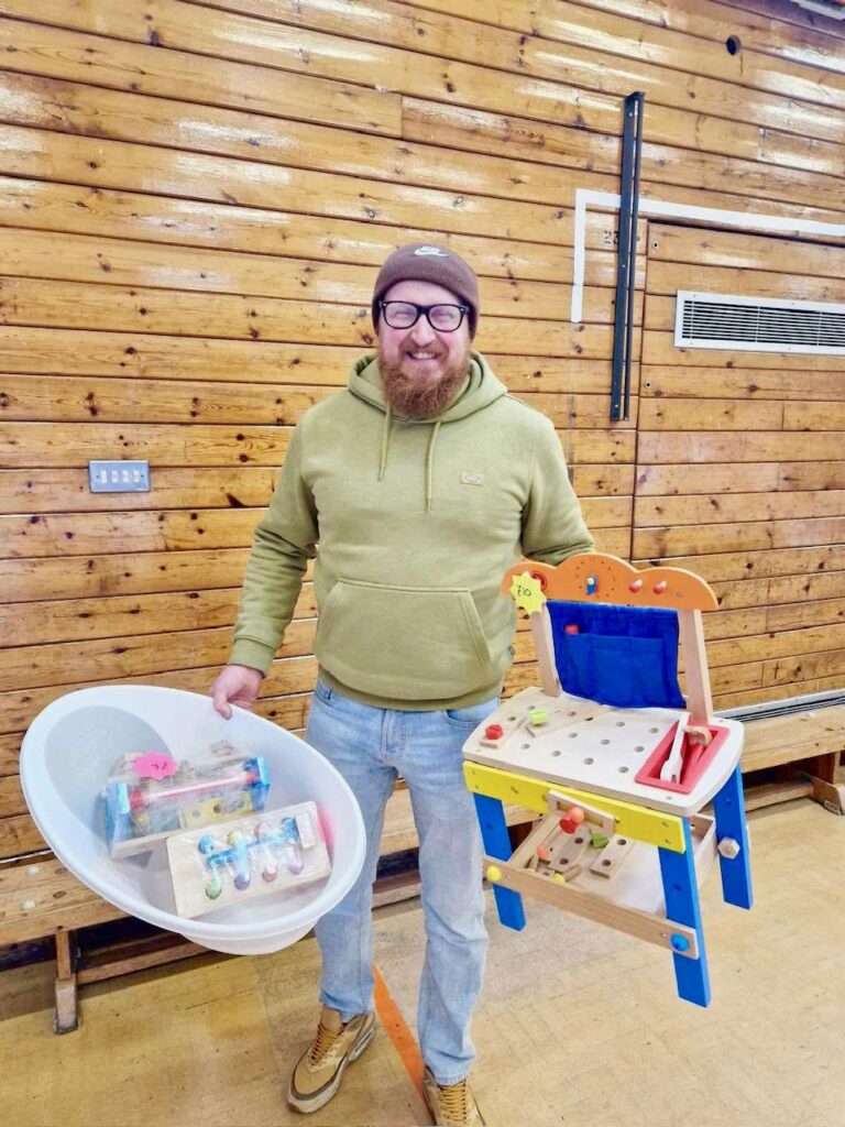 Attendee smiles at previous Baby Boutique sale