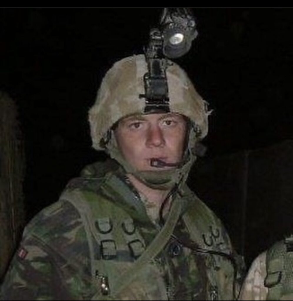 Gary Devonport, in the army with helmet and camouflage uniform on whilst serving in the army 