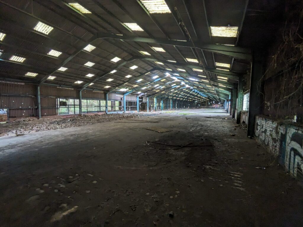 Inside a large run down warehouse