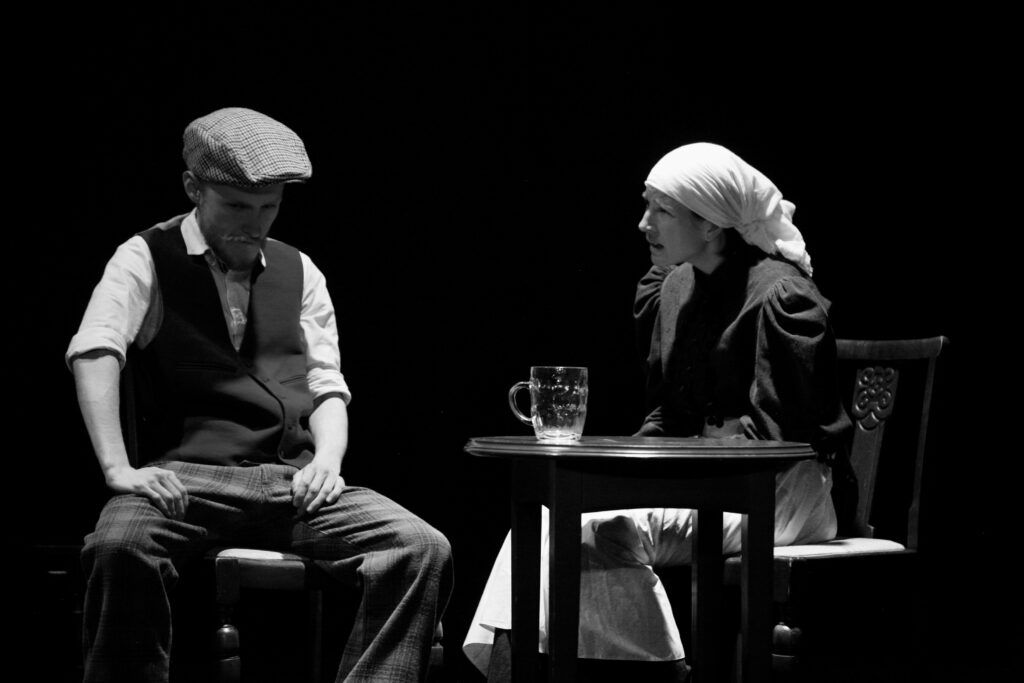 Actors performing on stage.