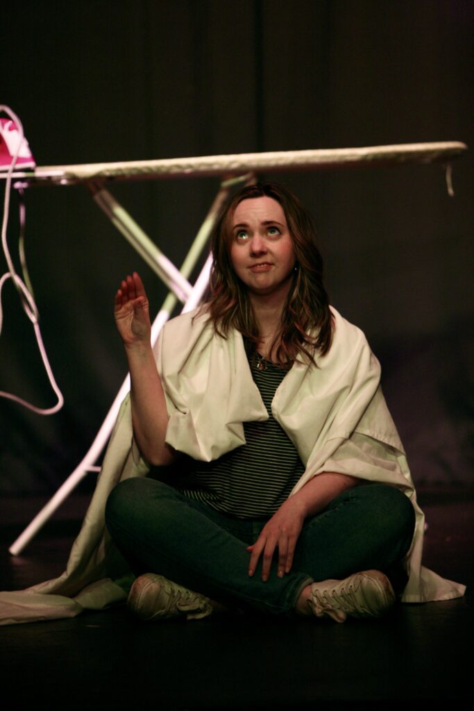 Actors performing on stage.