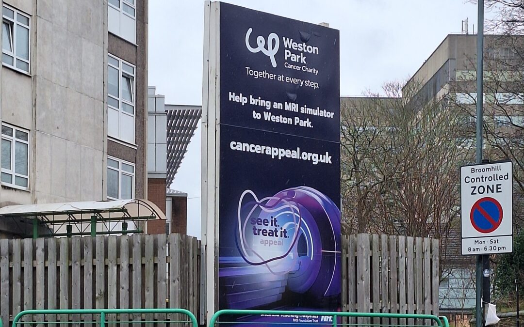 Image a sign board outside the Weston Park Cancer Centre, of an appeal for donations.