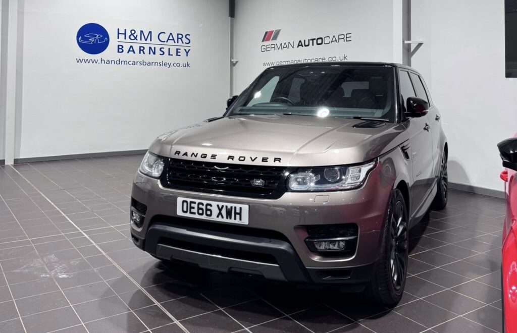 A grey Range Rover inside a car specialist garage
