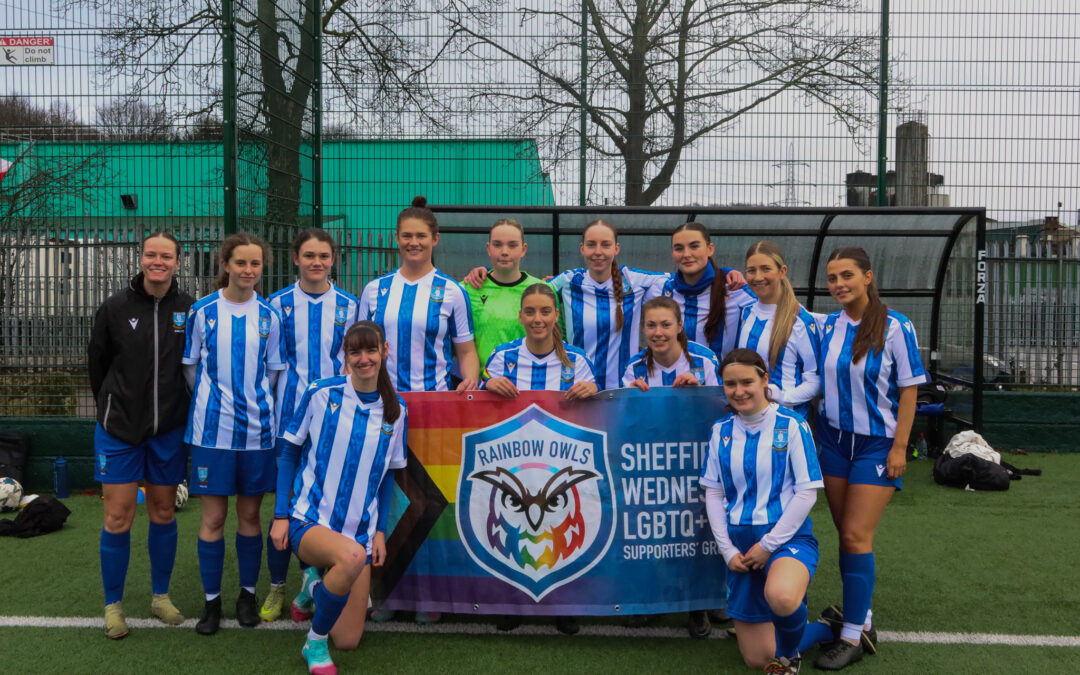 Sheffield Wednesday Women's Team hold up Rainbow Owls banner prior to kickoff.