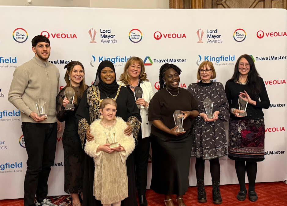 All 7 winners, and the Lord Mayor, lined up for a photo, holding their Lord Mayor awards.