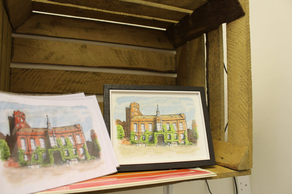 Two handmade watercolour architecture pieces of local landmarks. One picture is framed.