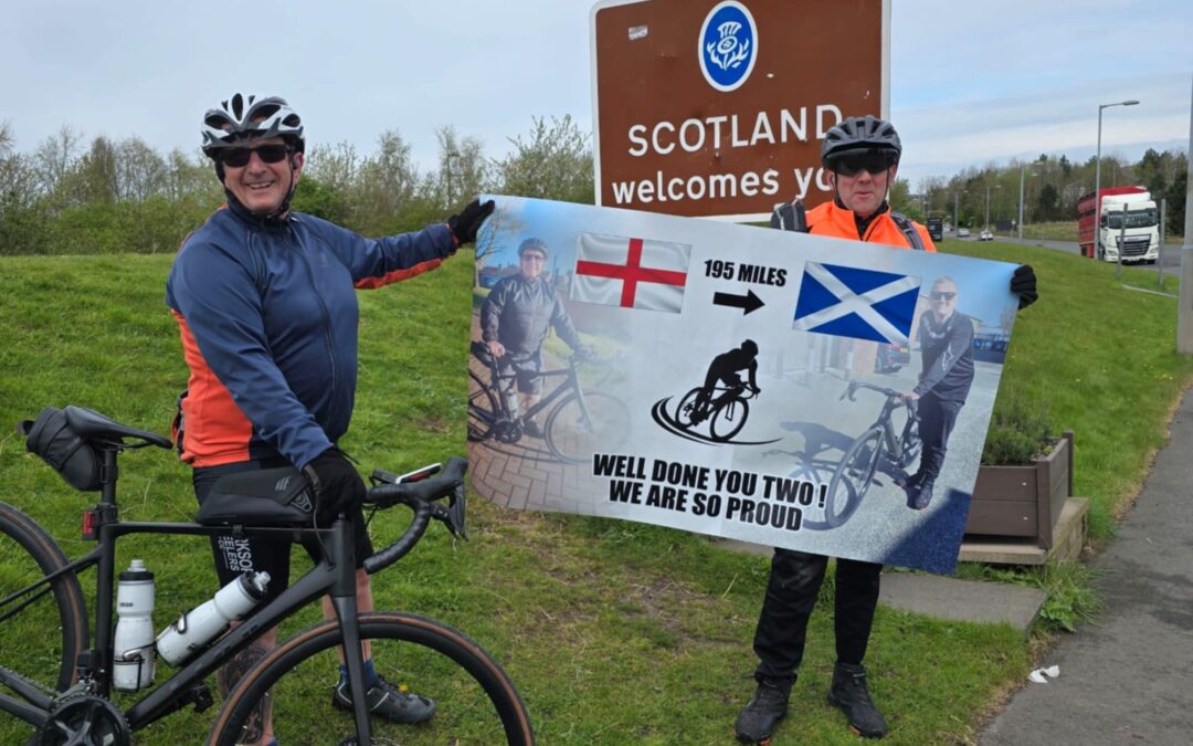 Mark Gebbie (left) and Glen Cutts (right) after completing their 195 mile cycle from Sheffield to Scotland