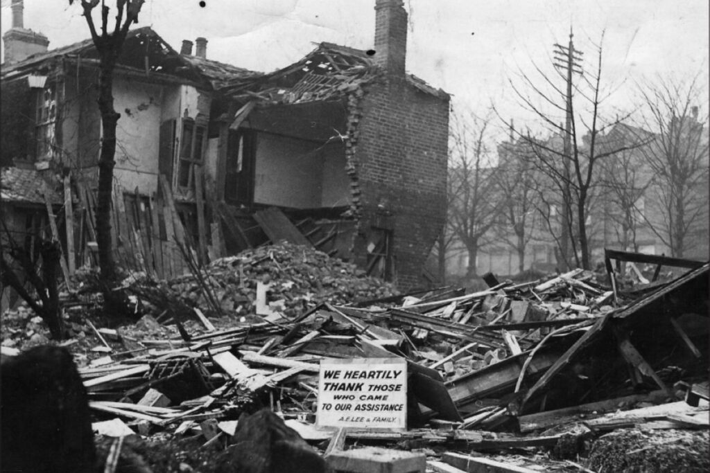 A photo of a building that has suffered bomb damage and is surrounded by rubble.