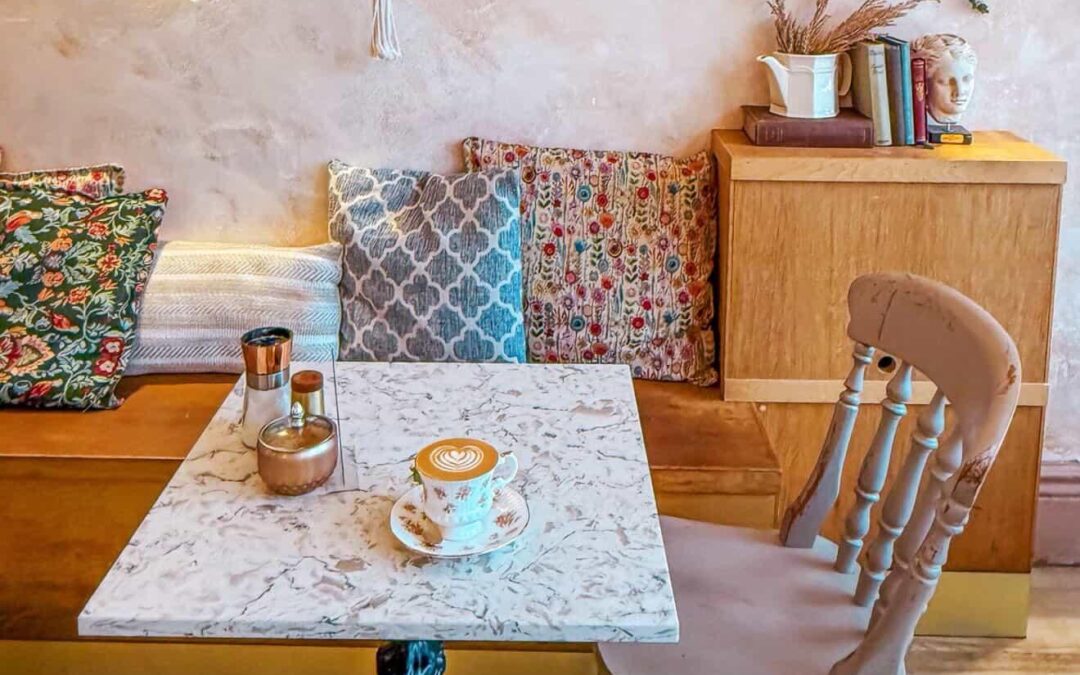 A picture of a table and chair at a coffee shop