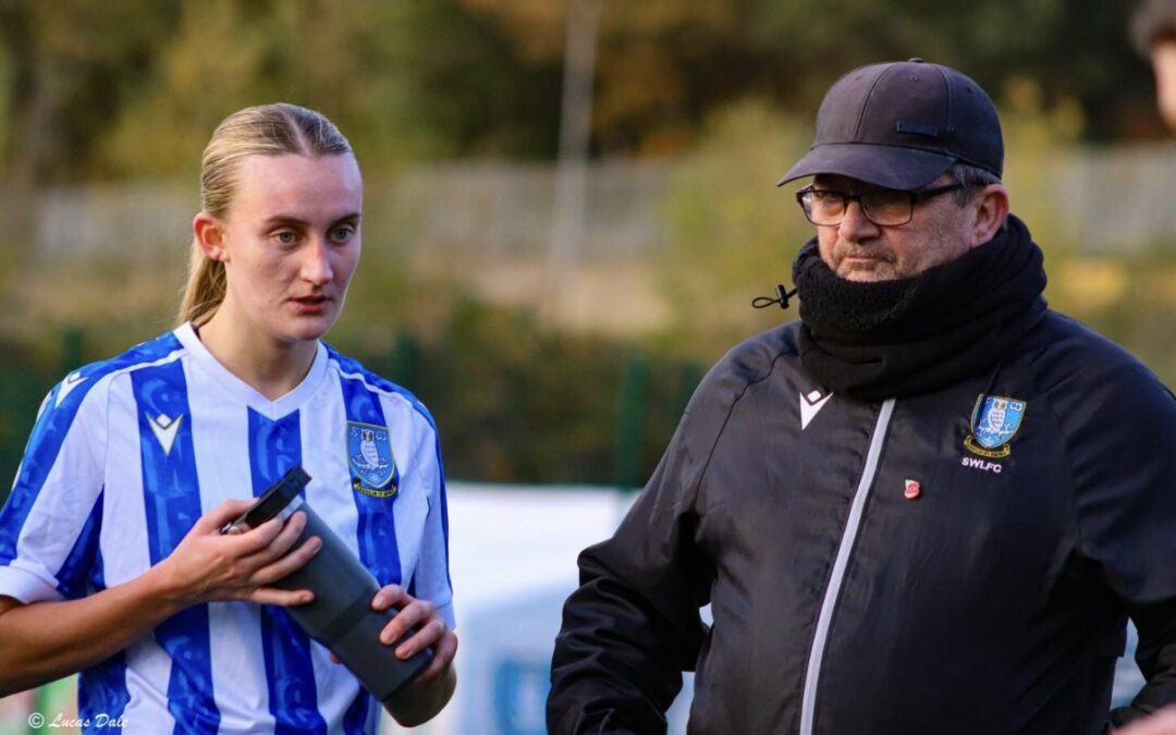 Manager Kieron Lee discusses tactics with Bekah Pratley