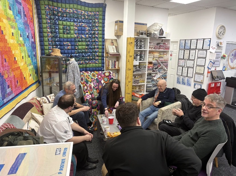 men sat around in a circle 