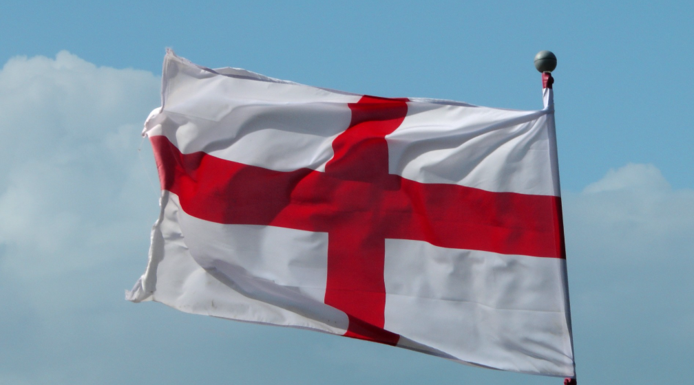 A picture of the English flag waving in the wind
