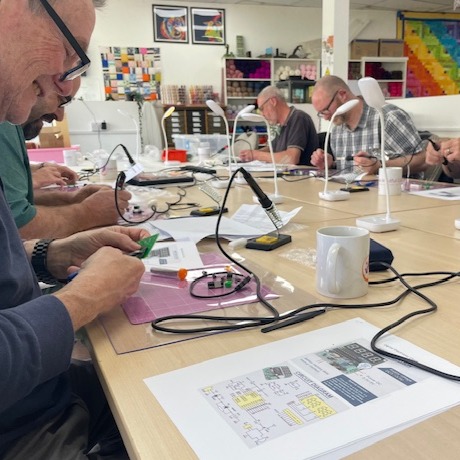 men with circuit board