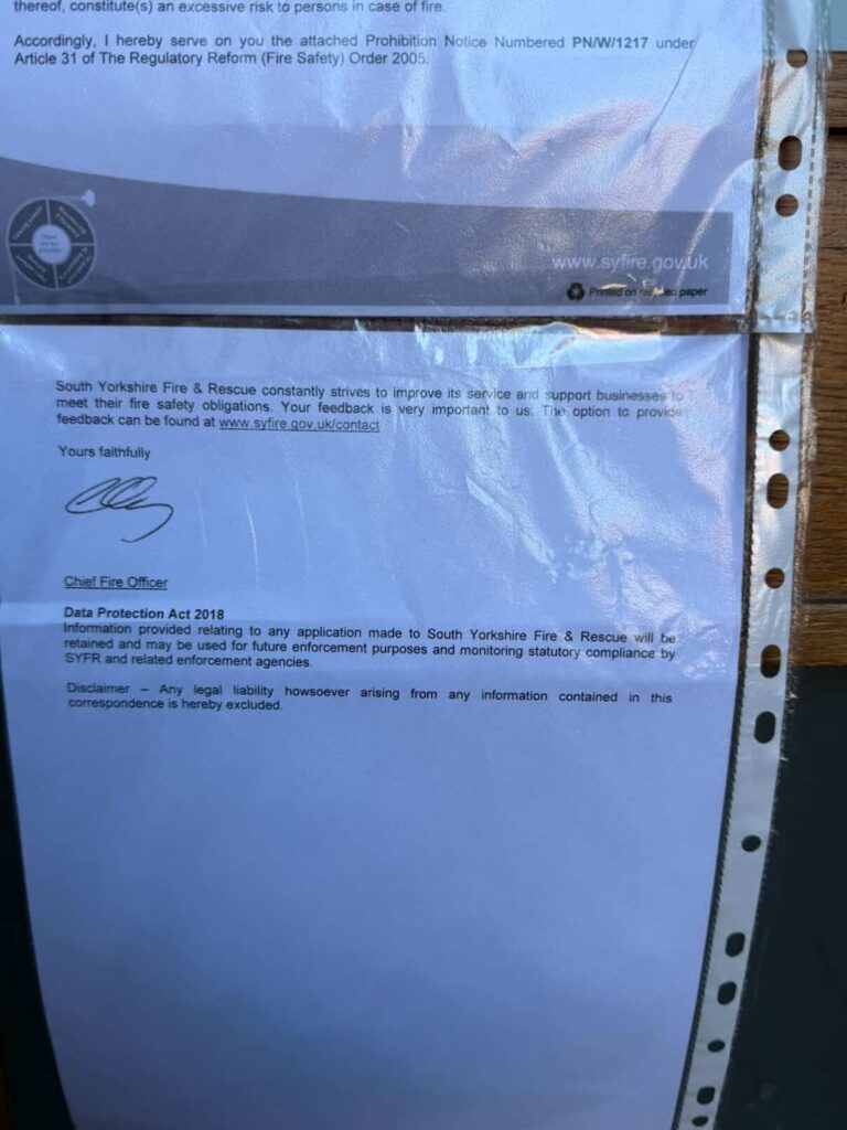 A peice of paper detailing the fact that residents of the flats must evacuate