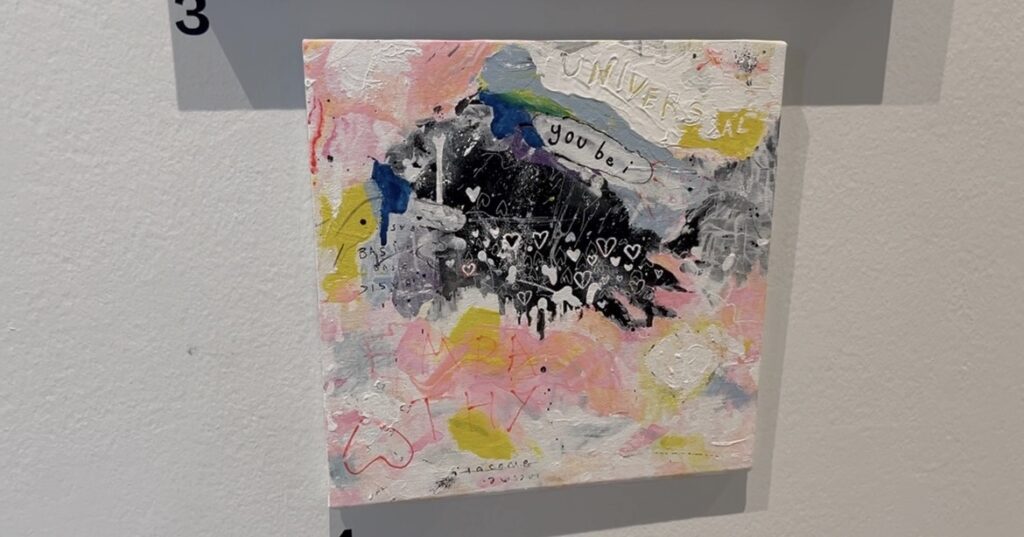 Artwork with pink black and blue paint
