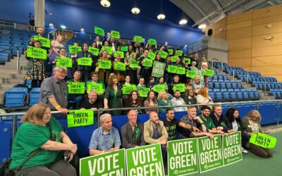 Green Party councillor jeered after waving Palestinian flag on stage