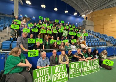 Green Party councillor jeered after waving Palestinian flag on stage
