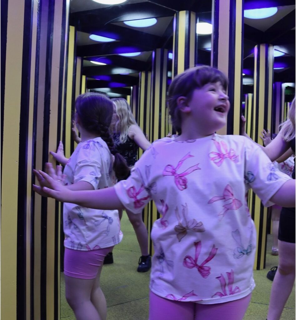 boy in a mirror maze