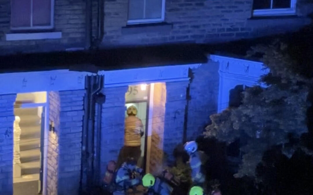 Firefighters seen rushing into the house to put out the fire.
